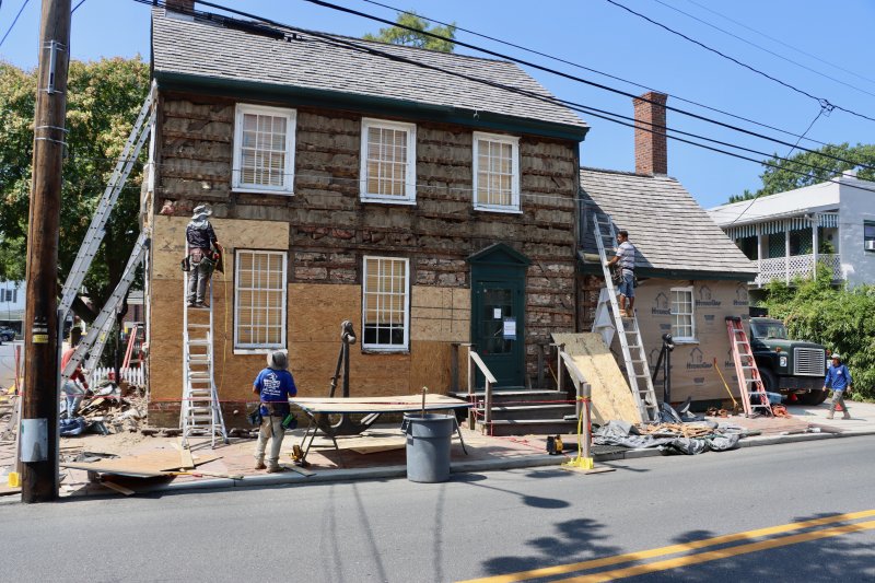 Workers began stripping the old wood from the building on the week of July 28.